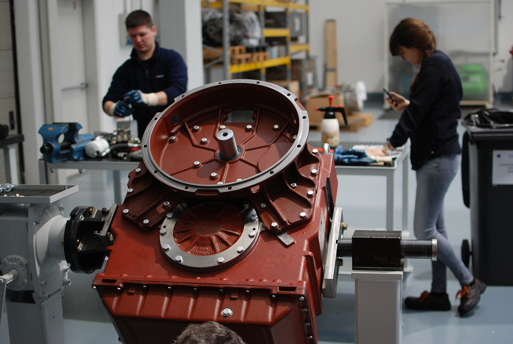 Closeup of a marine powertrain component in a workshop.